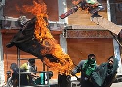 Protesters burn an effigy of Kashmiri Chief Minister Omar Abdullah in Srinagar on Wednesday. AFP
