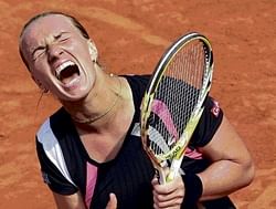 Ecstasy: Svetlana Kuznetsova celebrates her win against Serena Williams at the French Open in Paris on Wednesday. AP
