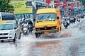 Monsoon magic: Vehicles wading through the water clogged roads in Mangalore. dh photo