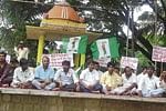 For a Common cause JD(S) district and youth wing members staging a protest opposing the Vikasa Sankalpa Yatra at Gandhi Vana in Kolar on Saturday. DH