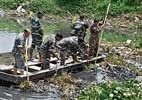 MEG personnel searching for Abhisheks body at Hennur Lake in Bangalore on Tuesday. DH photo