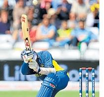Innovative: Tillakaratne Dilshan finds a new way to the boundary during his 74 against the West Indies. Reuters