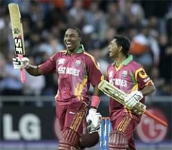 West Indies batsmen Dwayne Bravo, left, and Shivnarine Chanderpaul after defeating India.
