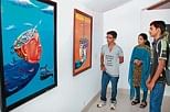 Vistors having a glimpse at the paintings exhibited at Akhters Art Gallery in Mangalore on Saturday.