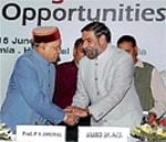Union Commerce & Industry Minister Anand Sharma (right) with Himachal Pradesh Chief Minister Prem Kumar Dhumal . PTI