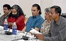 Engrossed: (From left) Arul Mani, Srinath Perur, C K Meena and Cheriyan Alexander.