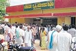 Farmers queue up to get sowing seeds in front of the Agriculture Department in Mulbagal on Monday.DH Photo