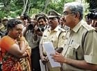 Kavitha, sister of torture victim, submitting a memorandum to Bangalore Rural Superintendent of Police Dr Mahesh in Bangalore on Friday. DH Photo