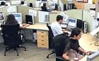 In hope of recovery: Employees at a Bangalore-based BPO unit.