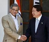 External Affairs Minister S M Krishna shakes hands with his South Korean counterpart Yu Myung-hwan at a meeting in New Delhi
