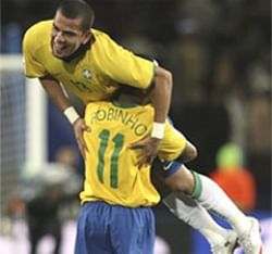 Brazil's Daniel Alves, right, is lifted by his teamamte Robinho after scoring a goal at the Confederations Cup semifinal at Johannesberg. AP