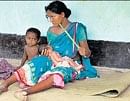 A woman with her newly born baby at a relief camp in Lalgarh, West Bengal, on Monday.