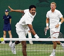 Mahesh Bhupathi (left) and his Bahamian partner Mark Knowles in action against Prakash Amritraj and Aisam-ul-Haq uring their mens doubles match. AFP