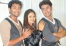 Actress Amulya flanked by Varun and Chethan Chandra.