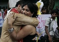 Two gay rights activists hug each other as they participate in the Rainbow Pride Walk in commemoration of the Stonewall riots, in Calcutta. AP