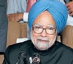 Making his point: Prime Minister Manmohan Singh addresses the media on-board his special plane. PTI