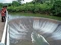 Water flows on the semi-circular structure of Chiklihole reservoir near Kushalnagar.  DH PHOTO
