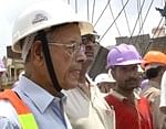 Metro Chief E Sreedharan visits the site at which the partially built metro bridge collapsed, in New Delhi on Sunday. PTI