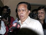ISRO chief Madhavan Nair, centre, talks to the media at ISRO headquarters in Bangalore on Friday. AP