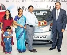 Tata Group chairman Ratan Tata presents the key to Mumbaikar Raghunath Vichare, owner of first Nano car, in Mumbai on Friday. PTI
