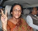 UPCC chief Rita Bahuguna Joshi, shows victory sign after her release from the jail on interim bail, in Moradabad on Saturday. PTI
