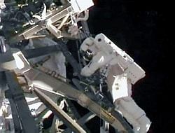 Astronaut Tim Kopra works during his spacewalk outside the International Space Station on Saturday. Reuters/NASA TV