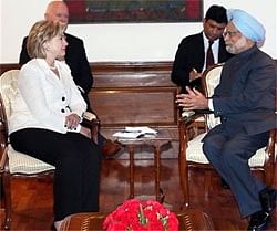 Prime Minister Manmohan Singh talks to US Secretary of State Hillary Clinton in New Delhi on Monday. AP