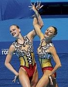 in sync Anastasia Davydova (left) and Svetlana Romashina clinched the womens synchronised swimming technical duet class gold on Tuesday.  Reuters