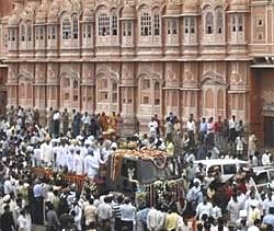 The funeral procession of the former queen mother of Jaipur, Gayatri Devi, passes by the historical Hawa Mahal on Thursday. PTI