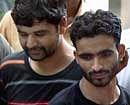 Hizbul Mujahideen militants Javed Ahmed (L) and Ashiq Ali (R) arrested by Delhi Police special cell in New Delhi on Friday. PTI
