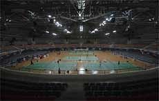 Badminton players are seen practicing at the Gachibowli indoor stadium in Hyderabad on Saturday, PTI