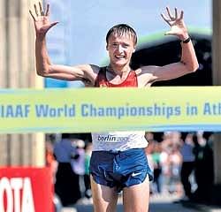 Russian Valeriy Borchin crosses the finish line to win the mens 20km walk gold on the opening day of the World Athletics Championships in Berlin.