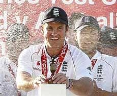 England's captain Andrew Strauss holds the Ashes urn after England won the Ashes Series against Australia at The Oval in London on Sunday. AP
