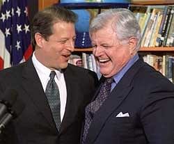 In a Jan. 5, 2000 file photo, Vice President and presidential hopeful Al Gore, left, shares a light moment with Sen. Edward Kennedy.