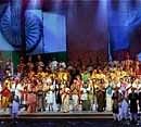 Folk artists from India stand together to thank the audience for the huge round of applause at the end of the concert. AP,