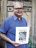 Inspired: Manohar with his book on Madurai;