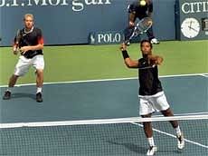 Leander Paes and his partner L. Dlouhy in action against Austrian duo of Julian Knowle and Jurgen Melzer during their 3rd round match at US Open. AP
