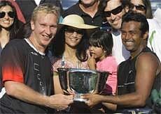 Leander Paes(R) of India, and Lukas Dlouhy, of the Czech Republic, with he trophy. In the centre is Paes' wife Rhea Pillai and their daughter Ayana.