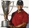 Tiger Woods holds the J.K. Wadley trophy after winning the BMW Championship golf tournament in Lemont, Ill., AP