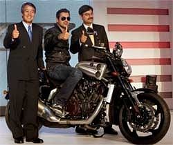 Actor John Abraham poses on the Yamaha 'VMax'. Also seen:CEO & MD, India Yamaha Motor, Yukimine Tsuji and National Business head Pankaj Dubey
