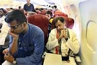 Minister of State for External Affairs Shashi Tharoor takes a nap  while traveling in an economy class flight. IANS