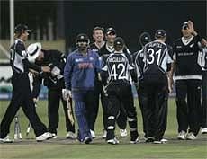 New Zealand players celebrate after India's Yusuf Pathan, in blue, is bowled out during a warm up match. AP