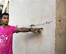A man shows the crack on a wall of an apartment follwing an earthquake in Guwahati on Monday. PTI