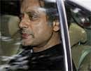 Minister of State for External Affairs Shashi Tharoor leaves after meeting with PM Manmohan Singh at his residence in New Delhi on Tuesday. PTI