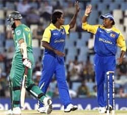 Sri Lanka's bowler Angelo Mathews (C), celebrates with Thilina Kandamby (R), after bowling South Africa's batsman Hashim Amla, left, for 2 runs.