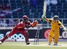 Australia's captain Ricky Ponting, right, is stumped out by West Indies wicket keeper Chadwick Walton, off the bowling of Nikita Miller for 74. AP