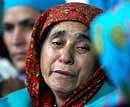 Mother of NeeloferJan at the graveyard during the exhumation of her daughter's body in Shopian town on Monday. PTI