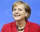 German Chancellor Angela Merkel reacts after the German general elections in Berlin on Sunday. AP