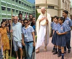 American 'Gandhi' Bernie Meyer (left) and Donald McAvinchey (right) in his Gandhi persona interacting with students in Chandigarh. IANS Photo