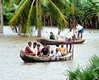 People travel in boats in a flood affected area of the Guntur district in Andhra Pradesh.
